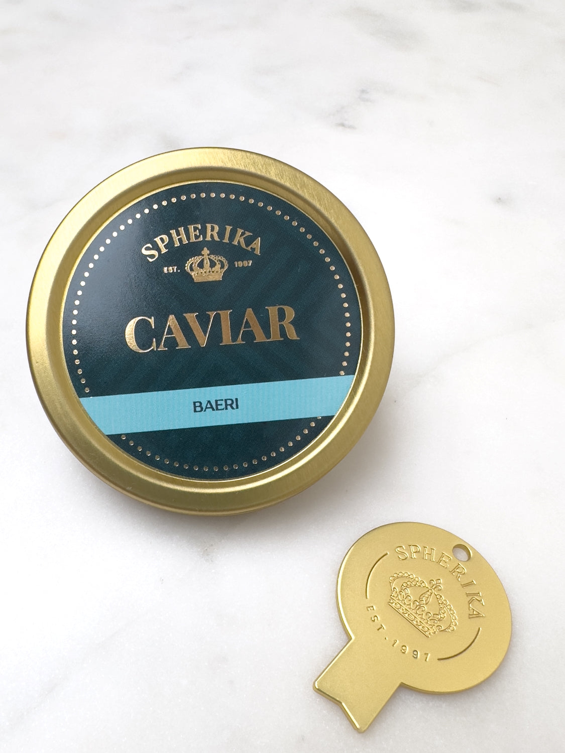 Llave de caviar Spherika, dorada